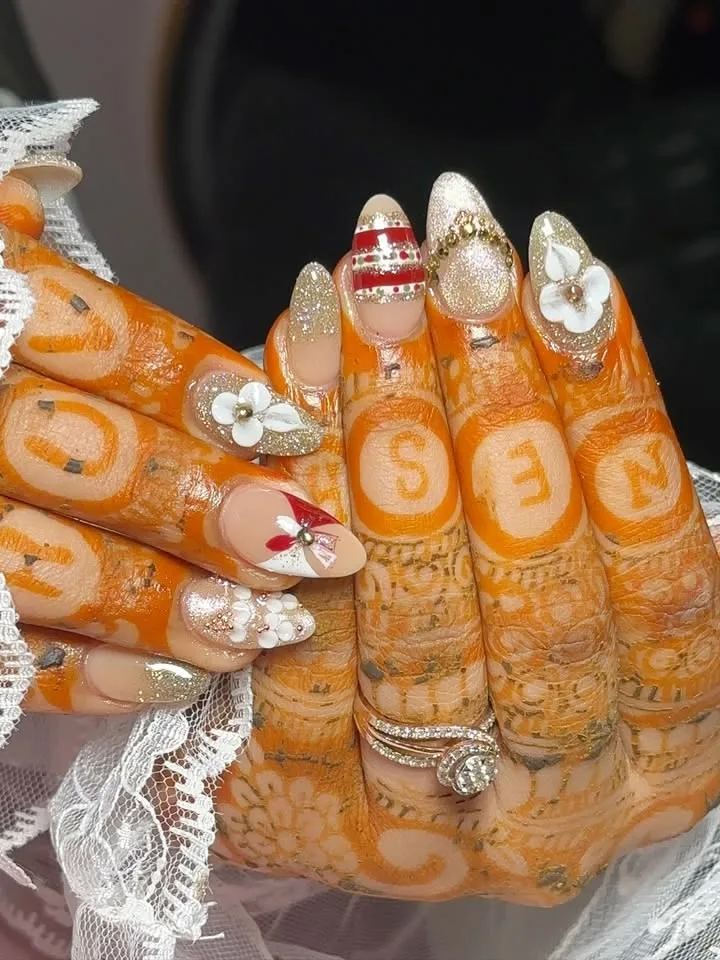 Ornate gold and pearl bridal nail art